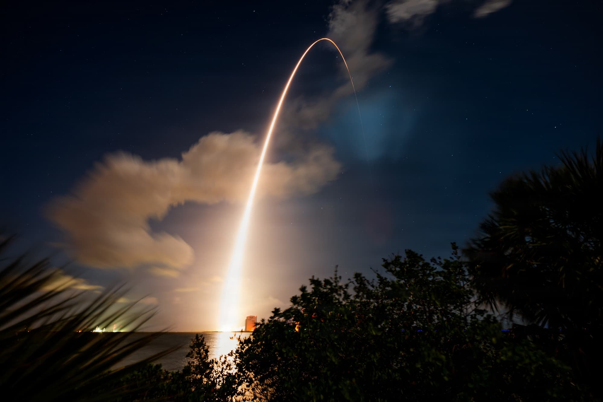 An Atlas V rocket launching at night from Cape Canaveral Space Force Station